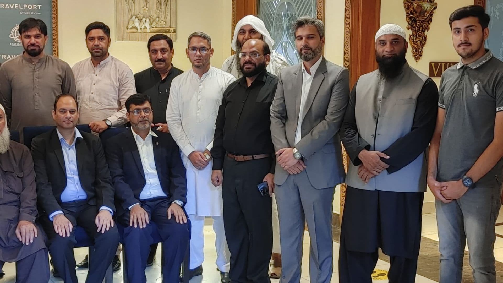 TAAG members and association representatives assembled in a formal indoor meeting setting.